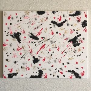 Red, black, white, and gold art piece